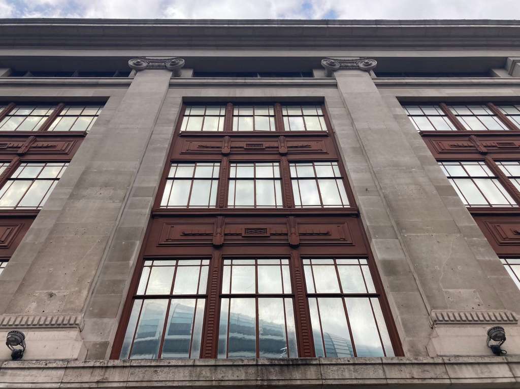 The 1920s building's oxidised panels and pilasters reference its world-famous neighbour Selfridges [
