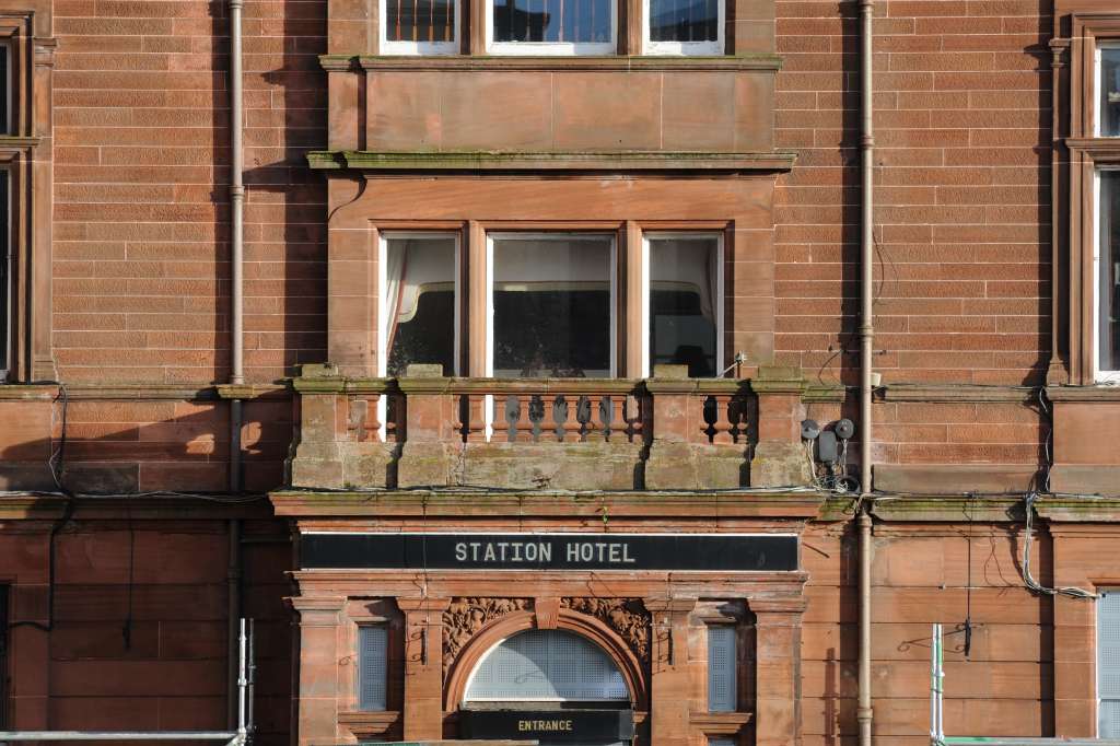 The former hotel entrance in 2018, signs of decay beginning to show (N Hackett)