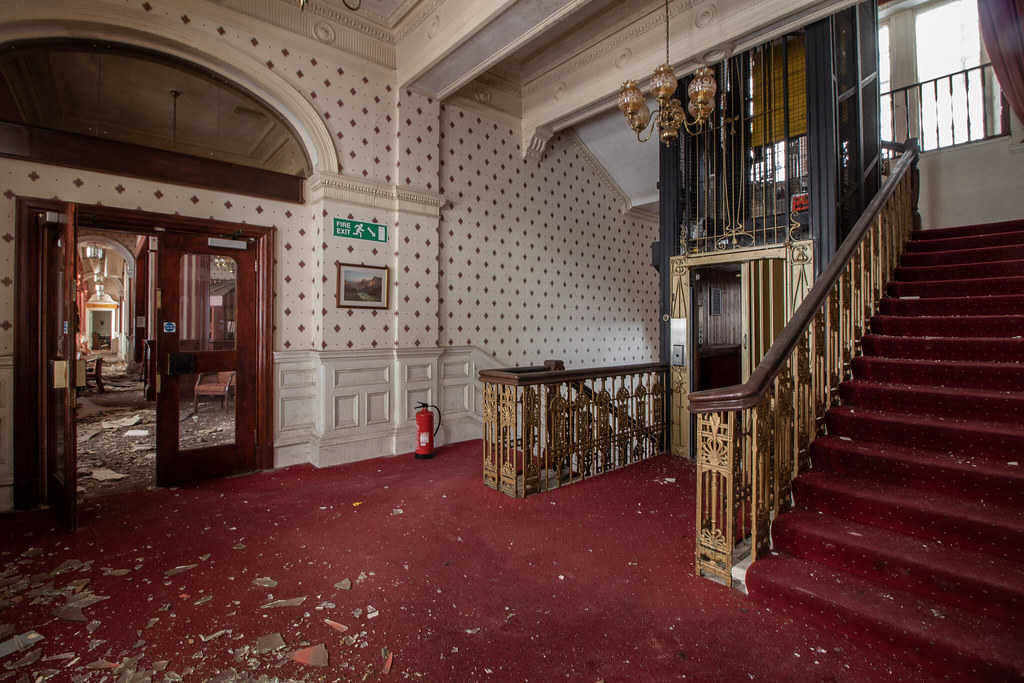 The grand central staircase in the south wing with Victorian lift cage [Credit: Urbex]