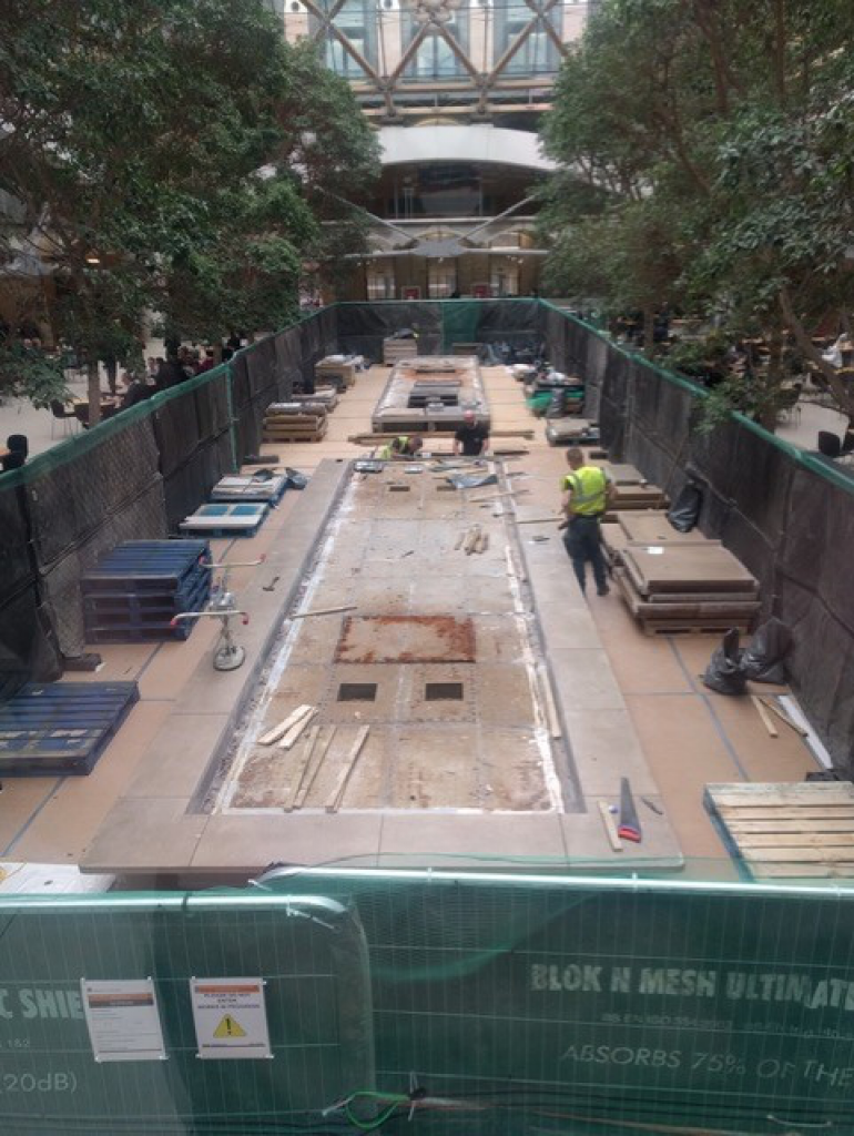 The water feature being dismantled