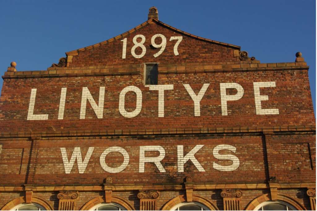 The legend 1897 LINOTYPE WORKS can be seen on the north façade of the Engine House, advertising the